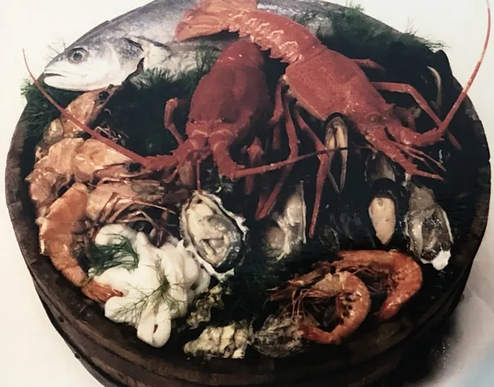 An archive photograph of a seafood platter of lobster, prawns, oysters and fish