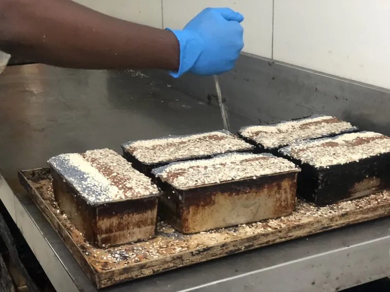 Seed loaves fresh out of the oven in their tins